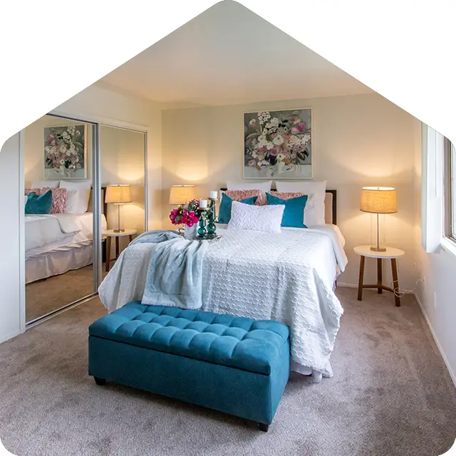 view of a spacious apartment bedroom at Bavarian Village on the Lake in Clarkston, MI.